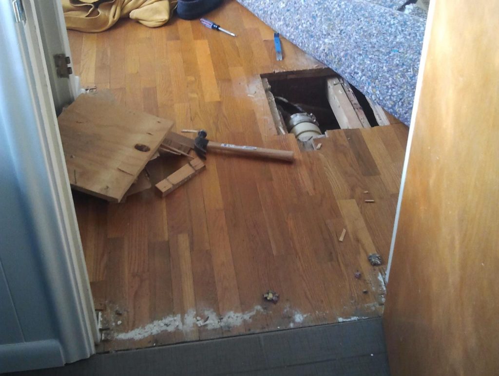 water leak damaged hardwood floors